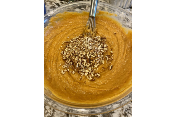 RV baking pumpkin bread with chopped nuts