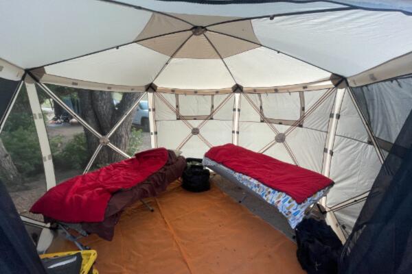 RV or tent camping Two cots inside a gazebo pop-up tent
