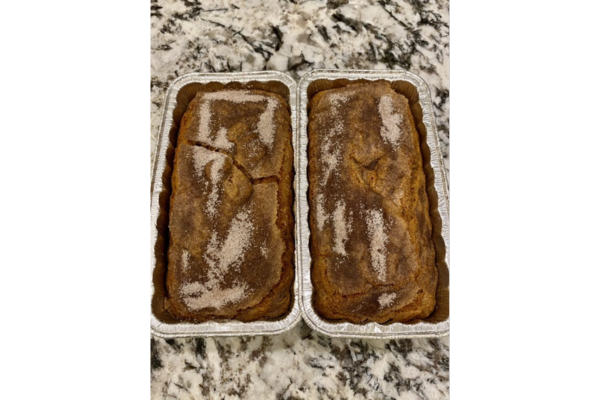 two loaves of pumpkin bread in tin pans side by side. RV baking.