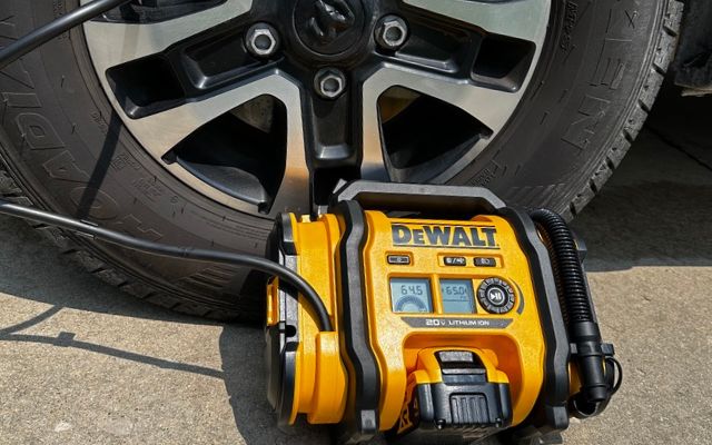 A Class B van tire with a portable air compressor